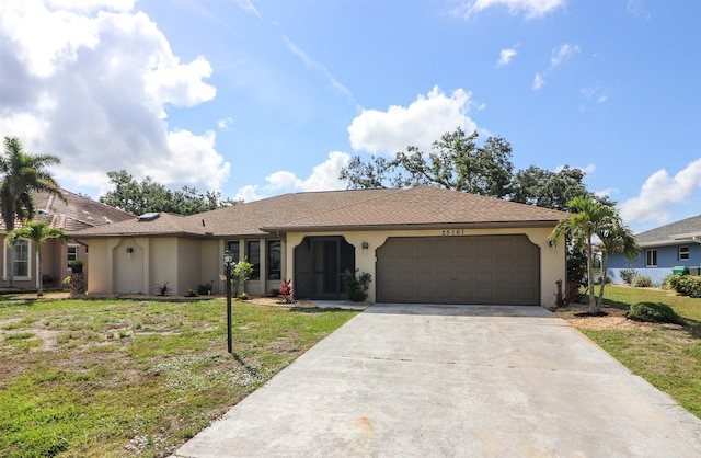 ranch-style home featuring a garage and a front yard