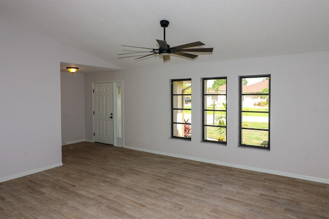 unfurnished room featuring a wealth of natural light, light hardwood / wood-style flooring, and ceiling fan