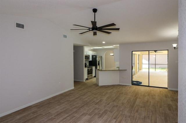 empty room featuring ceiling fan and hardwood / wood-style floors