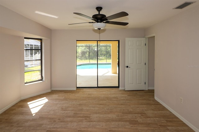 empty room featuring light hardwood / wood-style floors and ceiling fan