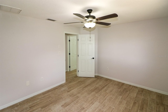 unfurnished room with ceiling fan and light hardwood / wood-style floors