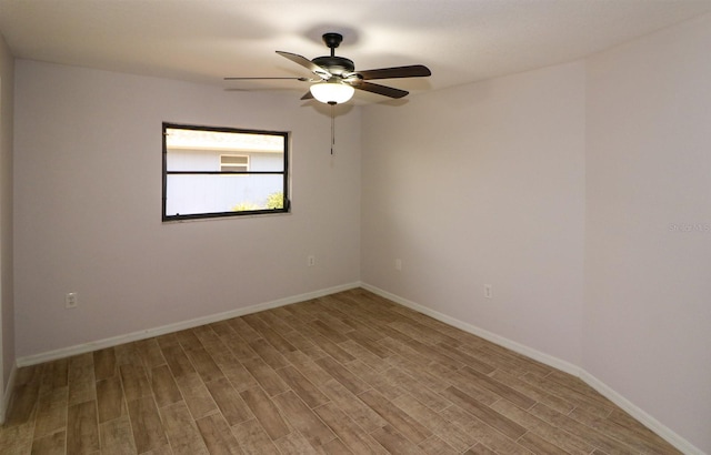 unfurnished room with ceiling fan and light wood-type flooring