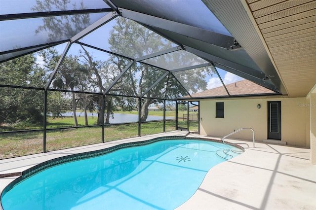 view of swimming pool featuring a lanai and a patio