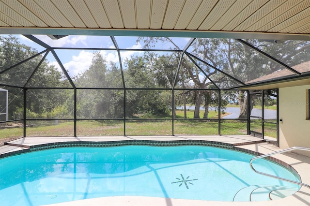 view of pool with glass enclosure