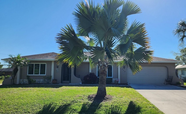 view of front of house with a garage and a front yard