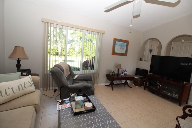 living room featuring ceiling fan and light tile floors