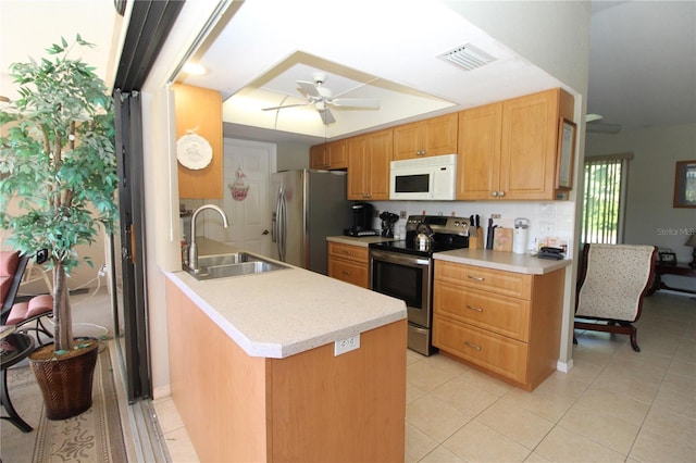 kitchen with ceiling fan, sink, stainless steel appliances, and light tile floors