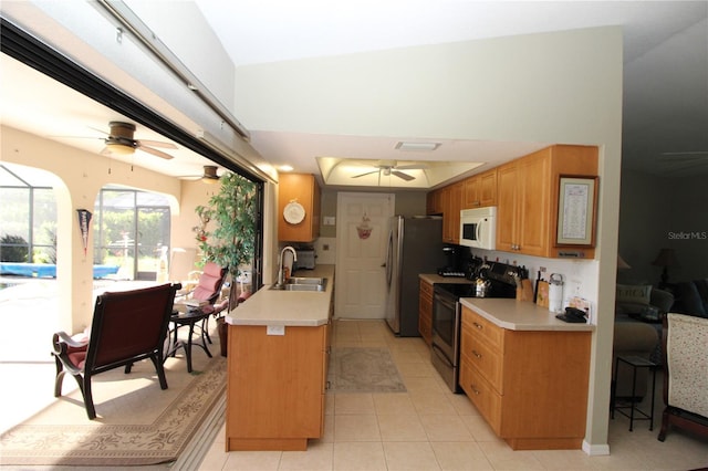 kitchen with sink, stainless steel range with electric stovetop, light tile flooring, and ceiling fan