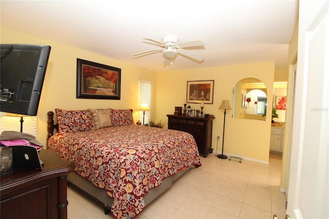 tiled bedroom with ceiling fan