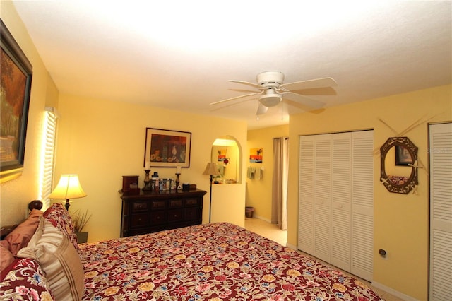 bedroom featuring ceiling fan and light carpet