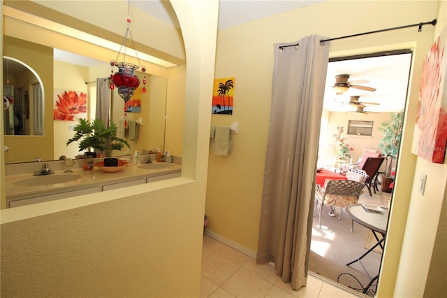 hallway featuring sink and light tile floors