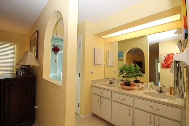 bathroom featuring double sink vanity and tile floors