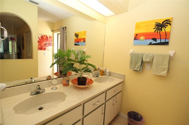 bathroom featuring double sink vanity and tile flooring