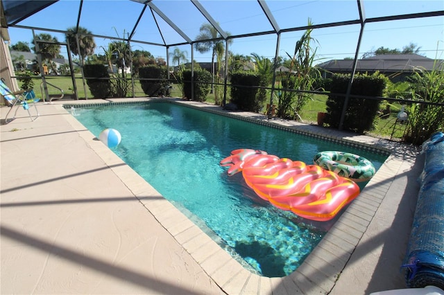 view of swimming pool with glass enclosure