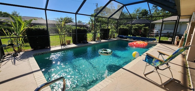 view of swimming pool featuring a patio area and glass enclosure