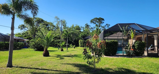 view of yard with a lanai