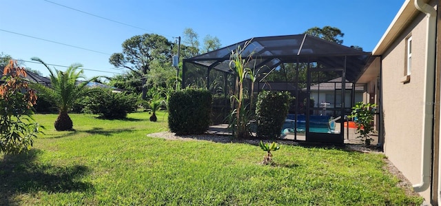 view of yard with a lanai