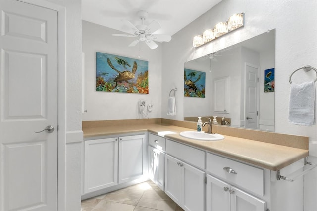 bathroom with ceiling fan, tile floors, and vanity