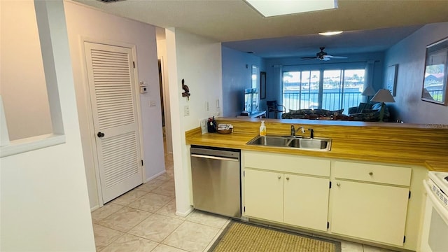 kitchen with sink, stainless steel dishwasher, ceiling fan, white range with electric stovetop, and light tile patterned flooring