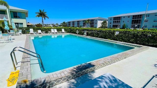 view of swimming pool featuring a patio area