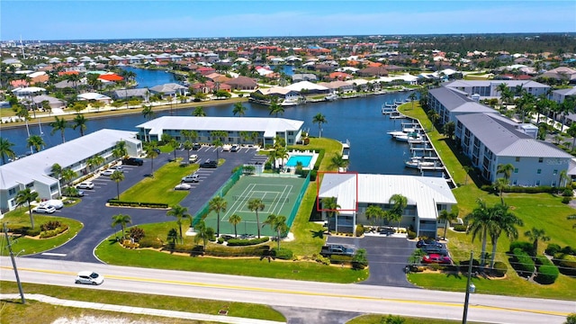 bird's eye view featuring a water view and a residential view