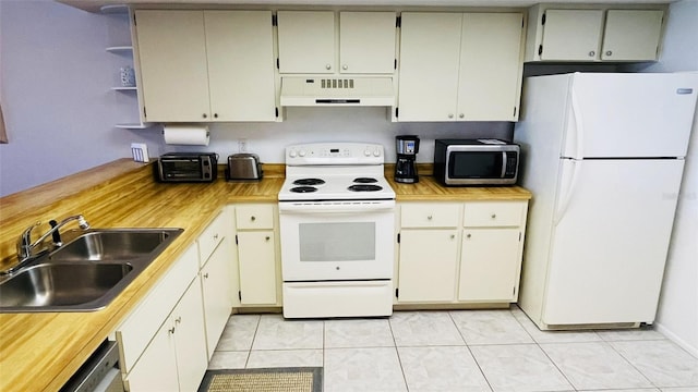 kitchen with white appliances, exhaust hood, sink, butcher block countertops, and light tile patterned flooring