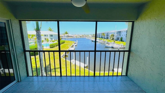 unfurnished sunroom with a water view