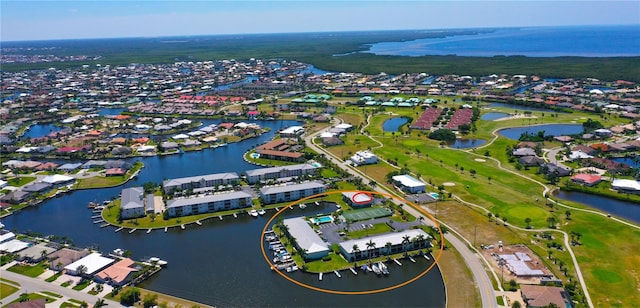 aerial view with a water view and a residential view