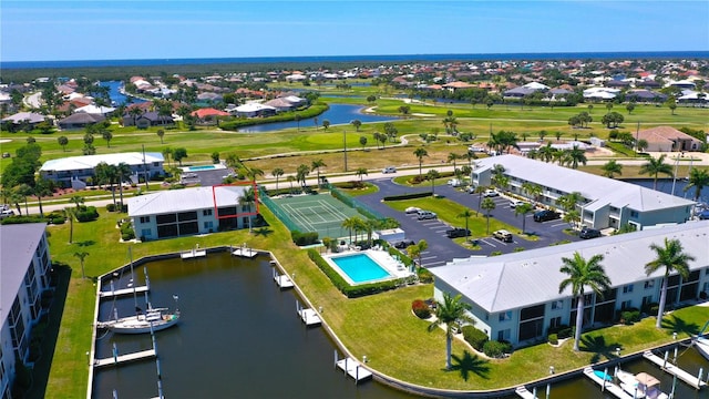 bird's eye view with a water view and a residential view