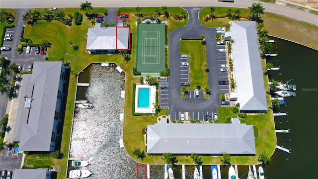 birds eye view of property with a water view