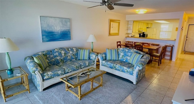 tiled living room with ceiling fan