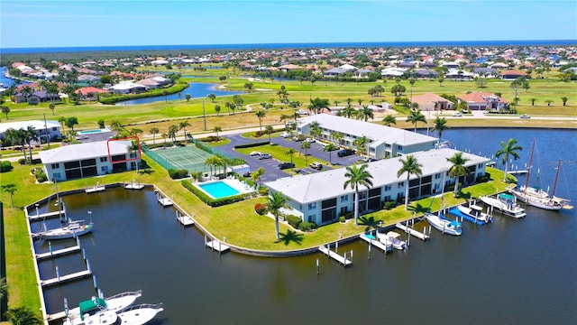 bird's eye view with a residential view and a water view