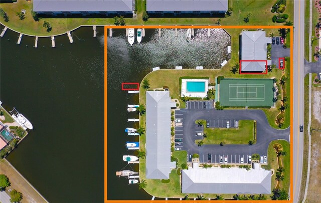 birds eye view of property with a water view