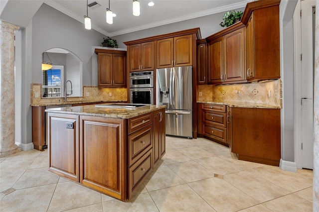 kitchen with stainless steel appliances, tasteful backsplash, pendant lighting, a center island, and light tile floors