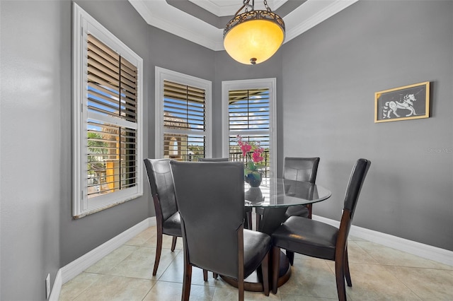 dining area with crown molding and light tile floors