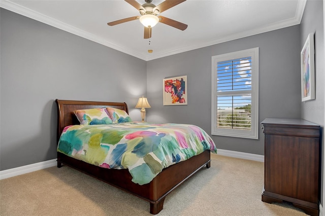 carpeted bedroom featuring crown molding and ceiling fan