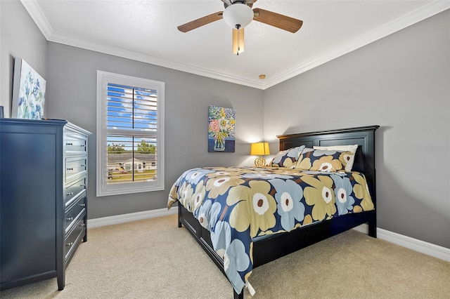 bedroom featuring light colored carpet, ceiling fan, and crown molding