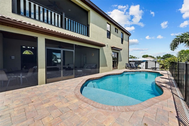 view of swimming pool featuring a patio