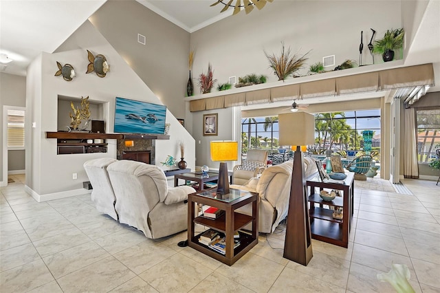 living room featuring ornamental molding, ceiling fan, and light tile flooring