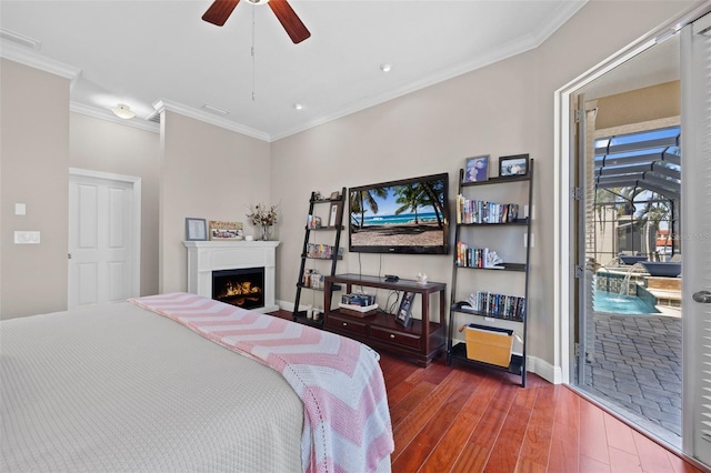 bedroom with ceiling fan, dark wood-type flooring, access to exterior, and ornamental molding