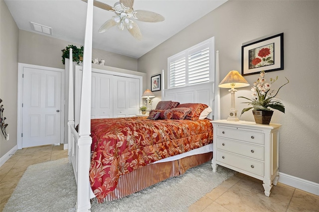 bedroom featuring a closet, ceiling fan, and light tile flooring