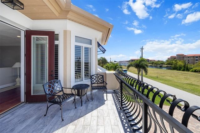 balcony featuring a water view