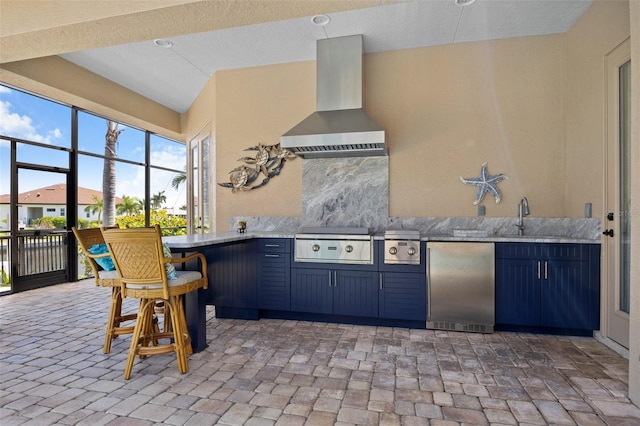 view of terrace featuring sink and an outdoor kitchen