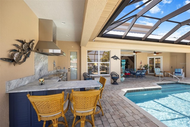 view of swimming pool featuring ceiling fan