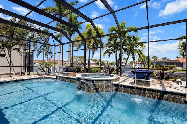 view of pool with glass enclosure, an in ground hot tub, and pool water feature