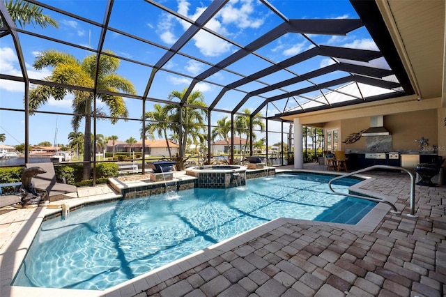 view of swimming pool with a patio area, pool water feature, an in ground hot tub, and glass enclosure