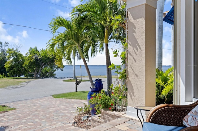 view of terrace featuring a water view