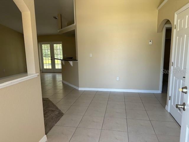 spare room featuring light tile flooring