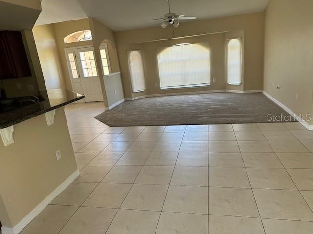 interior space featuring sink and ceiling fan