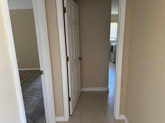 corridor with light tile flooring